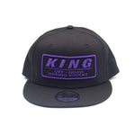 KING SHOCKS SNAPBACK BLACK HAT W/PURPLE LOGO- PT# APP-SB026